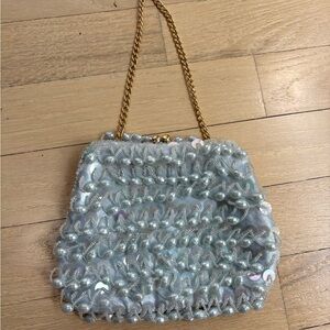 La Regale Shimmering Pearl Clutch with Gold Chain